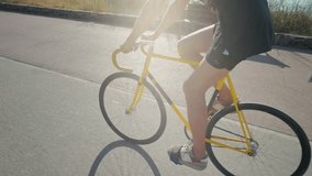 Man ride bicycle near beach in Barcelona, city morning, carbon neutral transportation. Travel, sustainability and cycling with male speed and transit, professional rider training, cardio outdoor sport - Powered by Shutterstock - Get 15% off with code: PIKWIZARD15