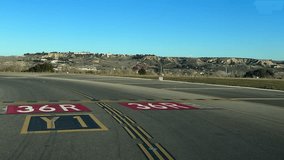 An unique pilot’s perspective from the cockpit of a jet airplane aligning into the runway ready for takeoff under a blue sky at the golden hour. 4K 60FPS - Powered by Shutterstock - Get 15% off with code: PIKWIZARD15