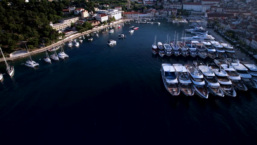 Hvar port in croatia, showing boats and the scenic coastline., aerial view