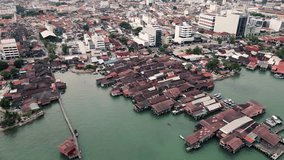 Aerial of George Town in Penang Island Malaysia with Jetties residential unesco neighbourhood street art graffiti - Powered by Shutterstock - Get 15% off with code: PIKWIZARD15