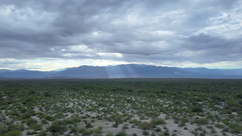 Light Passing Through Clouds Illuminating Cafayate Mountains, Salta Argentina