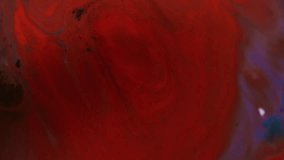 Bright fluid. Paint flow. Strange abstract red bloody curls leaking wavy. Enamel dye vivid mix decorative blur background with swirl effect. - Powered by Shutterstock - Get 15% off with code: PIKWIZARD15