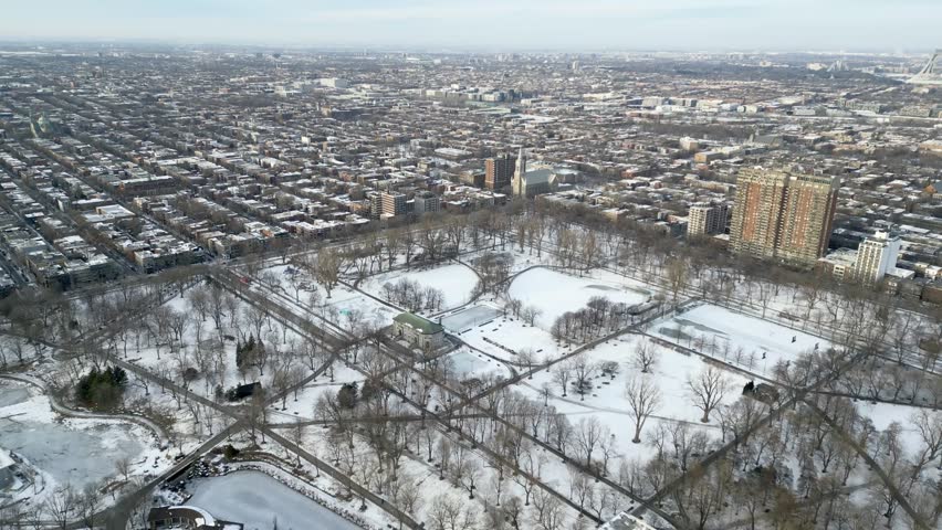 Winter park Fountain landscape with snow-covered freezing lake. Montreal, Quebec, Canada.