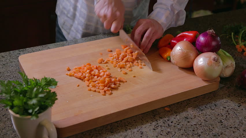 Man chopping carrots