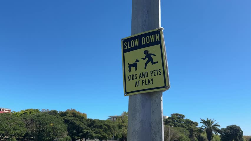 A sign asking people to be careful when driving or riding near the park. It shows that there are kids at play.
Cape Town - suburb of Mowbray.