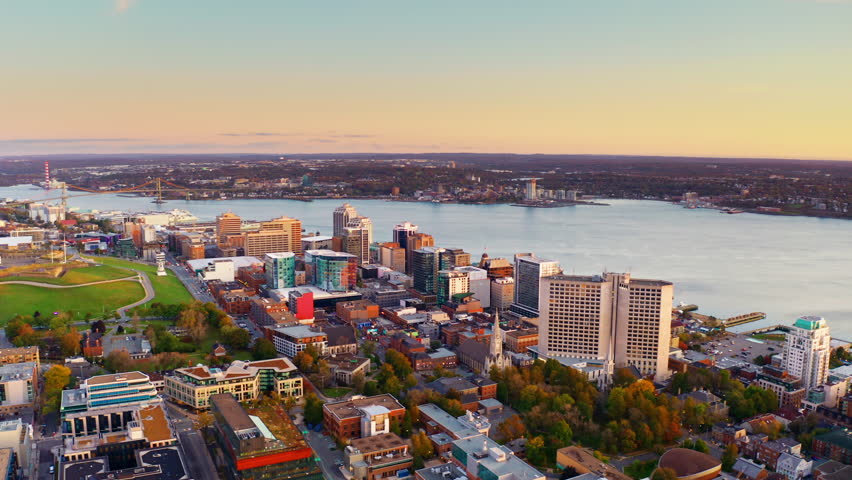 Aerial drone shot over Halifax downtown, Nova Scotia, Canada.
High view of the cityscape, ocean and the urban buildings.