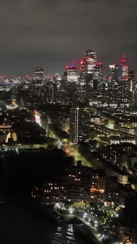 Vertical aerial timelapse of traffic in Shadwell, night in London city, England