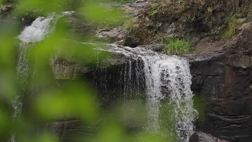 Slow motion stone waterfall landscape, water falling in Misiones Argentina Falls