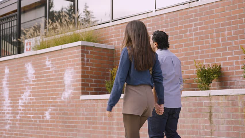 A couple walking and exploring the streets of port coquitlam