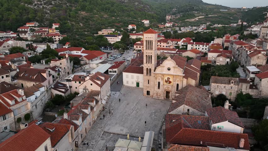 Hvar, croatia, showing rooftops and a church in the town square, aerial view