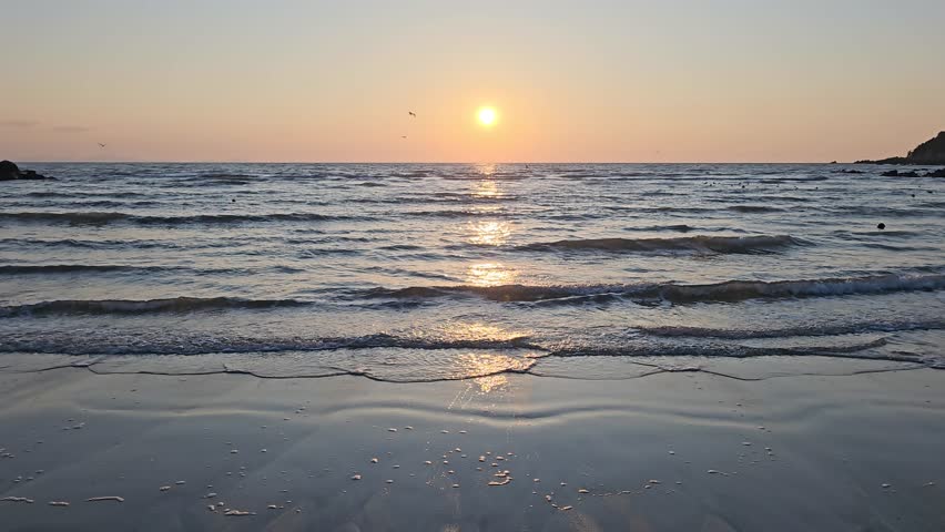 Sunset sky colored with orange color of winter at West Sea Beach in Yeongjong Island, Incheon, Korea