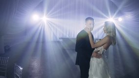 Romantic couple dancing first wedding dance at reception - Powered by Shutterstock - Get 15% off with code: PIKWIZARD15