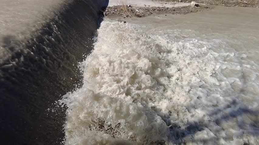A stormy stream of a mountain river after the snow melts.