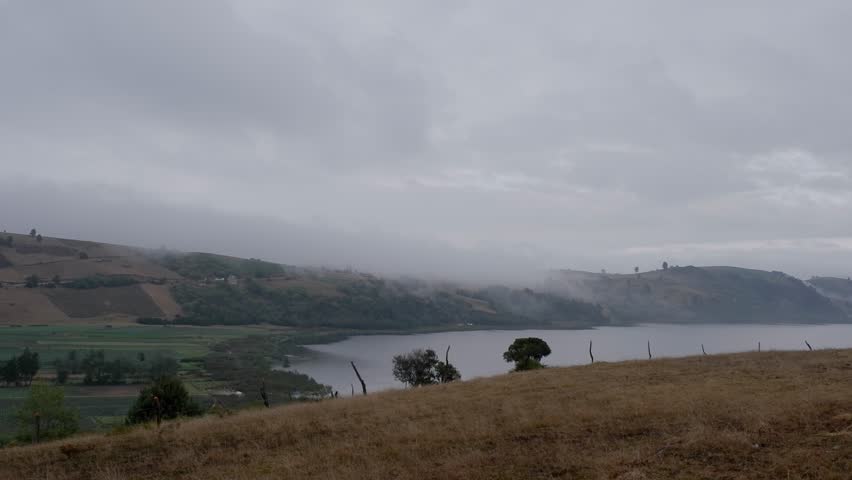 Lake with Mountains and Fog, Onion Fields in a Cold Landscape
