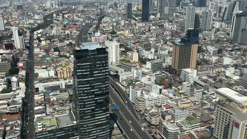 Bangkok, Thailand – February 11, 2025: Bangkok cityscape. Aerial view of Bangkok city from roof of a skyscraper hotel Lebua
