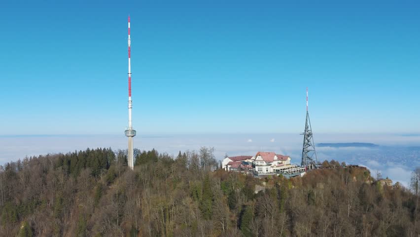 uetliberg mountain peak zurich switzerland hotel restaurant communication tower nearby train station forest trees also included aerial drone footage swiss alps scenic perspective