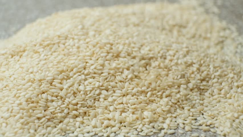 White Sesame Seeds Pour Slow Motion Close-Up