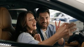 Happy Caucasian couple make selfie photo picture mobile phone video call conference blog influencer thumb up smiling in auto woman girl female with man guy male in car automobile auto social media - Powered by Shutterstock - Get 15% off with code: PIKWIZARD15