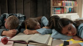Caucasian four friends pupils tired exhausted fatigued students teens and teenagers boy guy male girls female at school library class sleeping napping on table books sleep together studying education - Powered by Shutterstock - Get 15% off with code: PIKWIZARD15