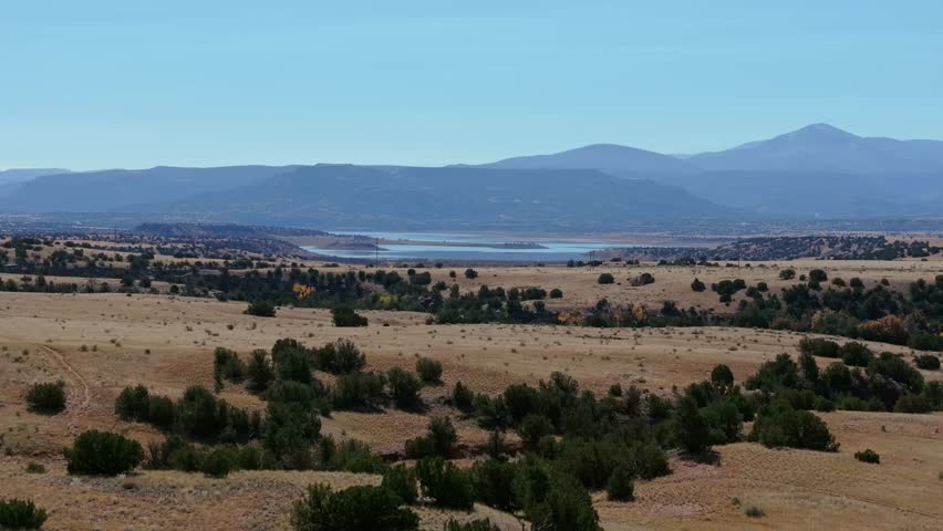 Scenic aerial view of Abiquiu Lake, New Mexico with surrounding hills and dry landscape