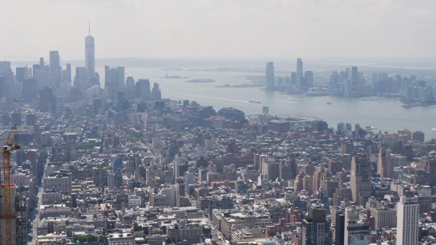 Slow motion landscape of New York city CBD Manhattan Queens from the Empire State Building tower buildings skyscrapers Wall Street Hudson River USA America travel tourism