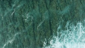 Static top down view of waves breaking on shallow fringing reef in ocean water, angled water - Powered by Shutterstock - Get 15% off with code: PIKWIZARD15