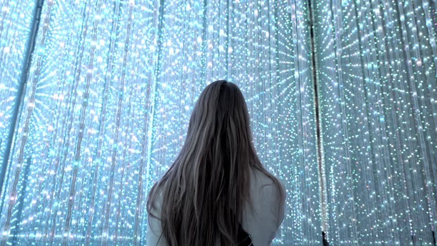 The scene showcases the enchanting blend of vibrant colors and immersive digital art that defines this world-renowned exhibit. Perfect for capturing the magic of modern art in Japan.