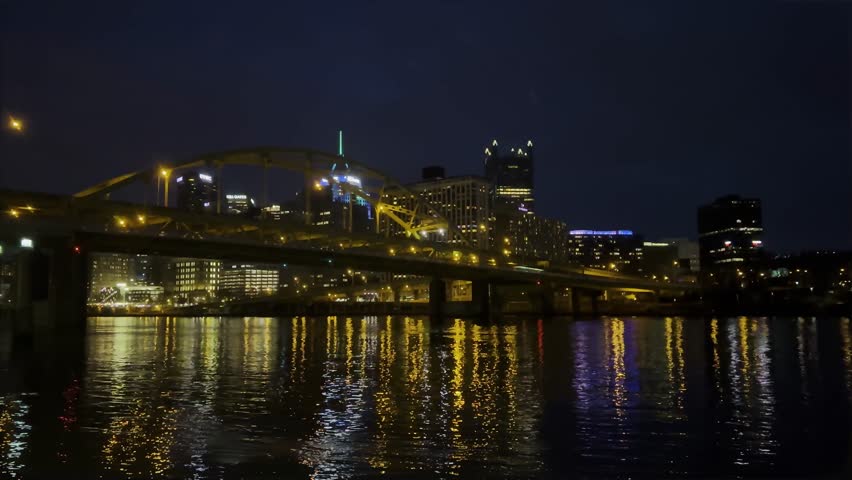 Andy warhol bridge over allegheny rive in Pittsburgh during holidays. Pittsburgh downtown market square light up with colorful lights during Christmas holiday season.
