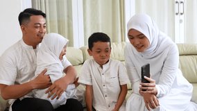 Muslim Family Enjoying Video Call Together at Home - Powered by Shutterstock - Get 15% off with code: PIKWIZARD15