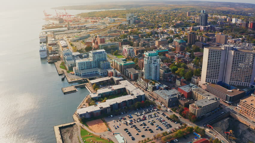Aerial drone shot over Halifax downtown, Nova Scotia, Canada.
High view of the cityscape, ocean and the urban buildings.