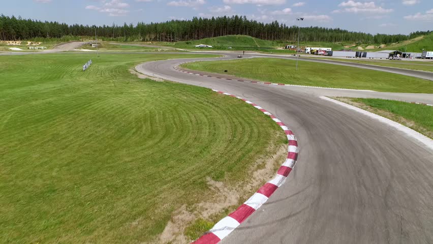 Thrill of the Race Bird's-Eye View of a Latvian Karting Track on a Vibrant Summer Day