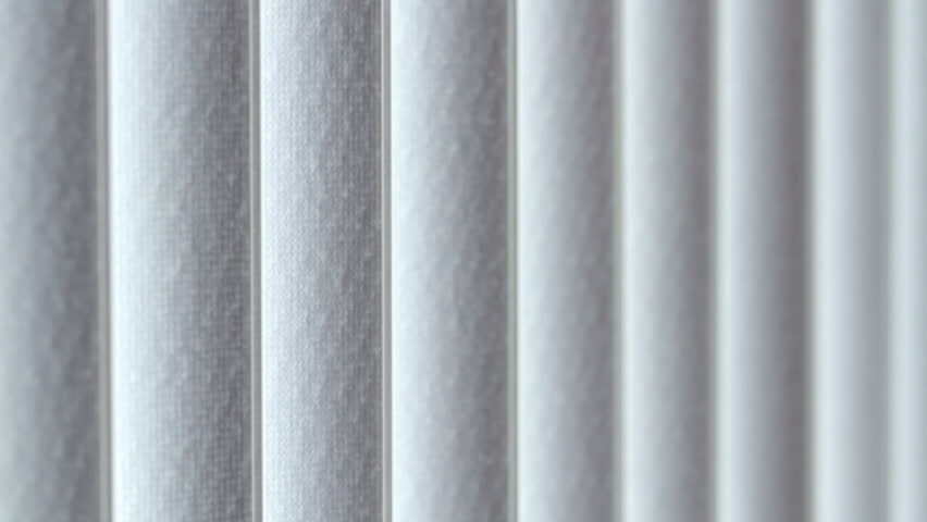Vertical blinds open creating a transition point. This clip transitions all the