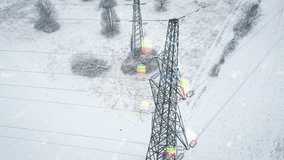 Power lines stretching across a snow-covered landscape with digital battery icons overlayed, symbolizing energy storage and the rising cost of electricity. Concept of power supply and market trends - Powered by Shutterstock - Get 15% off with code: PIKWIZARD15