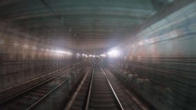 Speed underground train riding in tunnel. Subway train moving fast at dark tunnel. Urban metro driving belowground. Point of view from the railway cabin. Transportation of people concept. Hyperlapse - Powered by Shutterstock - Get 15% off with code: PIKWIZARD15