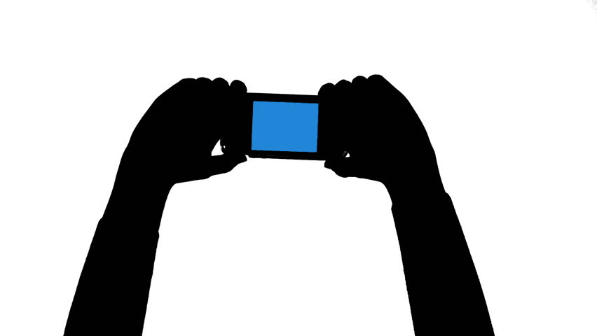 Silhoutted hands in close up taking pictures or video with a cellphone. Black