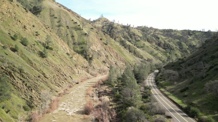 Sunlight glistens on the surface of Cache Creek as it weaves through the Rumsey valley in this aerial footage.