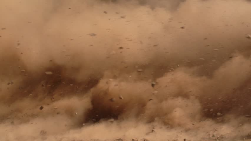 Massive dust and debris cloud, dramatic and chaotic scene, ideal for disaster, action, and cinematic effects. Slow-motion, copy space
