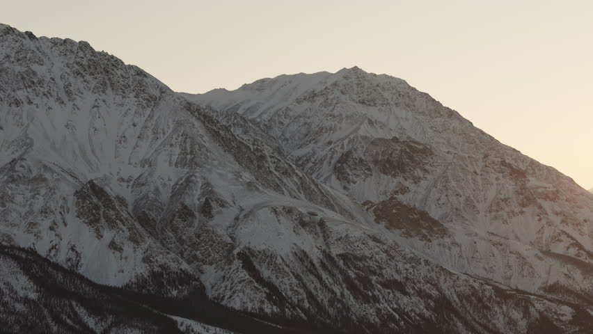 Snow Rock Mountains With Sunset Glow Near Silver City In Kluane National Park and Reserve, Yukon, Canada. Wide Shot
