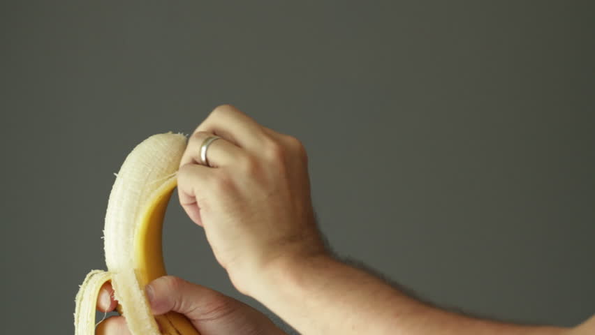 Peeling the skin from a banana. Shot with a macro lens and shallow depth of
