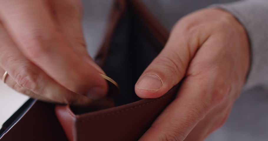 Opening empty wallet, leather purse without money, having financial problems during cash crisis, bankruptcy, low income, finance unemployment, bad personal bankruptcy and budget crisis suffer