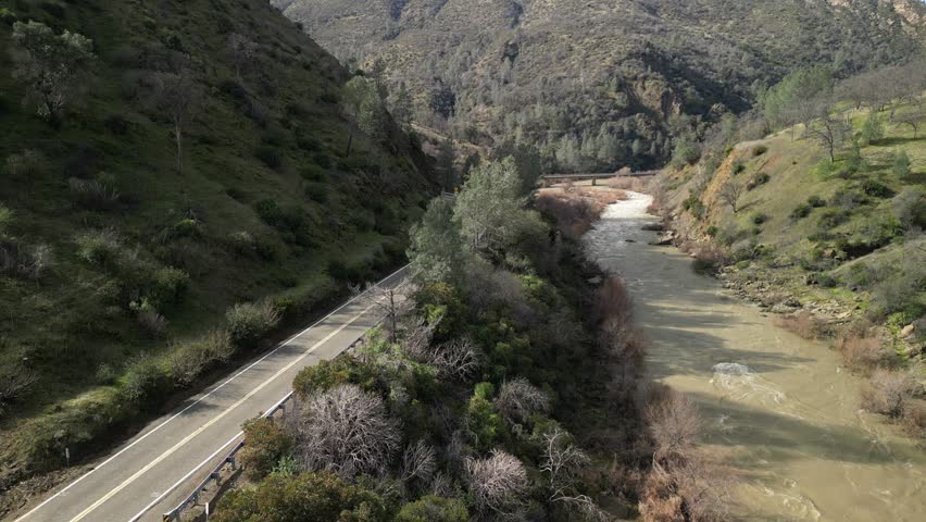 The vibrant hues of the surrounding landscape complement the cool blues and greens of Cache Creek’s waters.