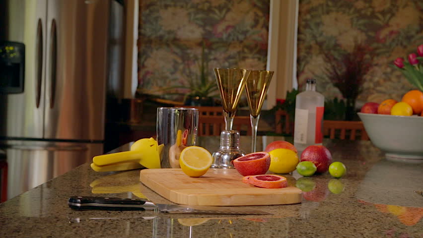 Woman squeezing lemon for cocktails