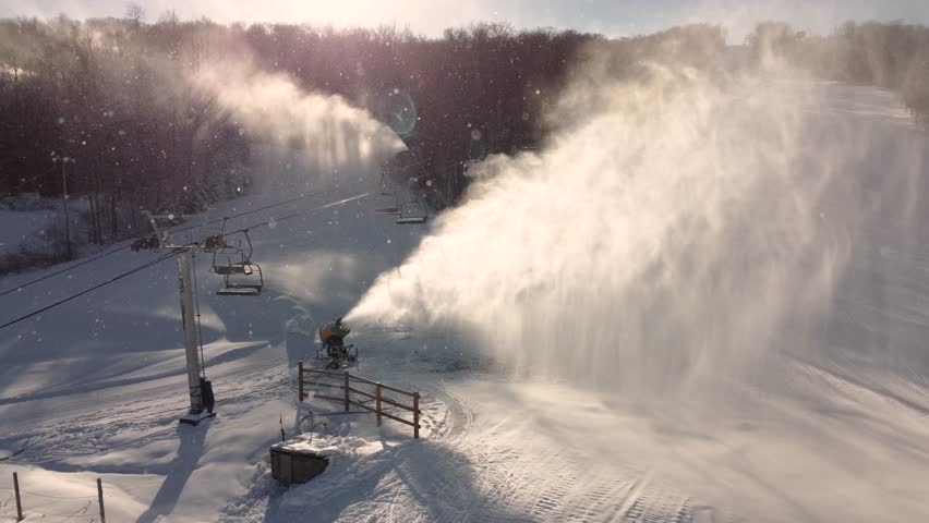 Snow cannon in action over the St-Sauveur ski resort, Quebec, Canada