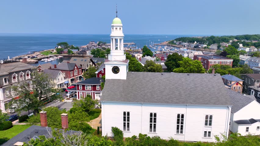 First Congregational Church aerial view with Rockport Harbor at the background in historic town center of Rockport, Massachusetts MA, USA. 