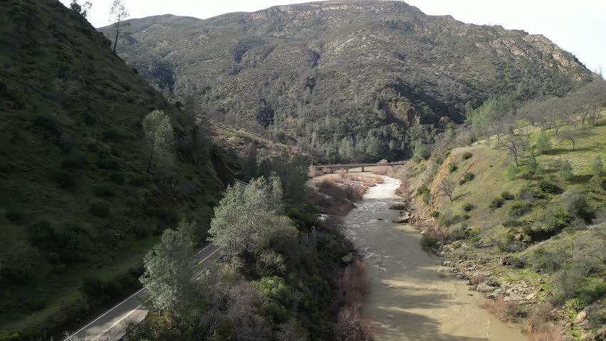 From above, Cache Creek appears as a ribbon of water cutting through the rugged California countryside.
