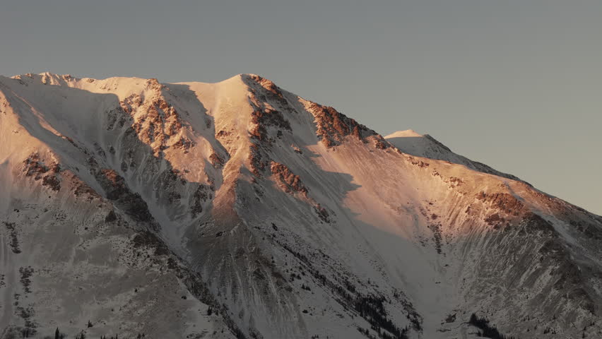 Sunset Glow Over Snow Mountains Near Silver City In Kluane National Park and Reserve, Yukon, Canada. Aerial Close-up Shot
