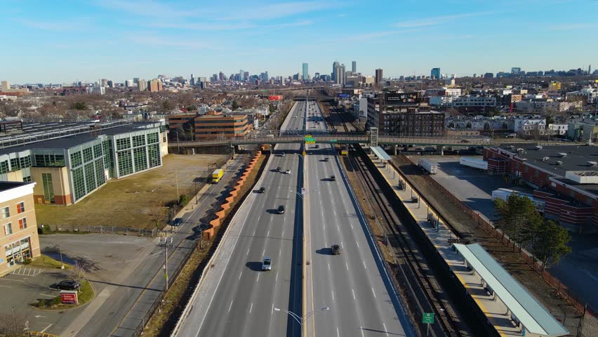 Interstate Highway 90 eastbound aerial view with Boston Back Bay at the background in Boston Landing, Massachusetts MA, USA. 
