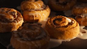 Drizzling Icing On Top Of Cinnamon Rolls. - closeup shot - Powered by Shutterstock - Get 15% off with code: PIKWIZARD15