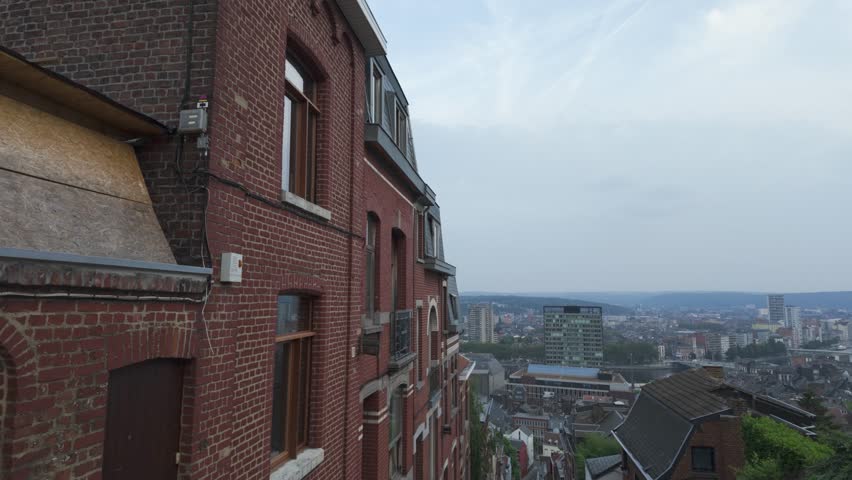View of the cityscape of Liege from the top of the historic Montagne de Bueren, a steep staircase lined with brick buildings