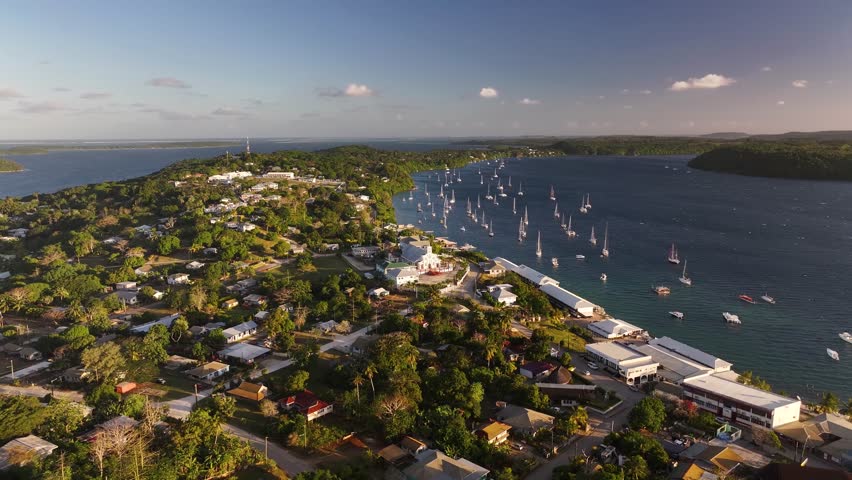 Beautiful coastal scenery Neiafu, Tonga. Historic church and waterfront with anchored boats. Vava'u Island. Aerial